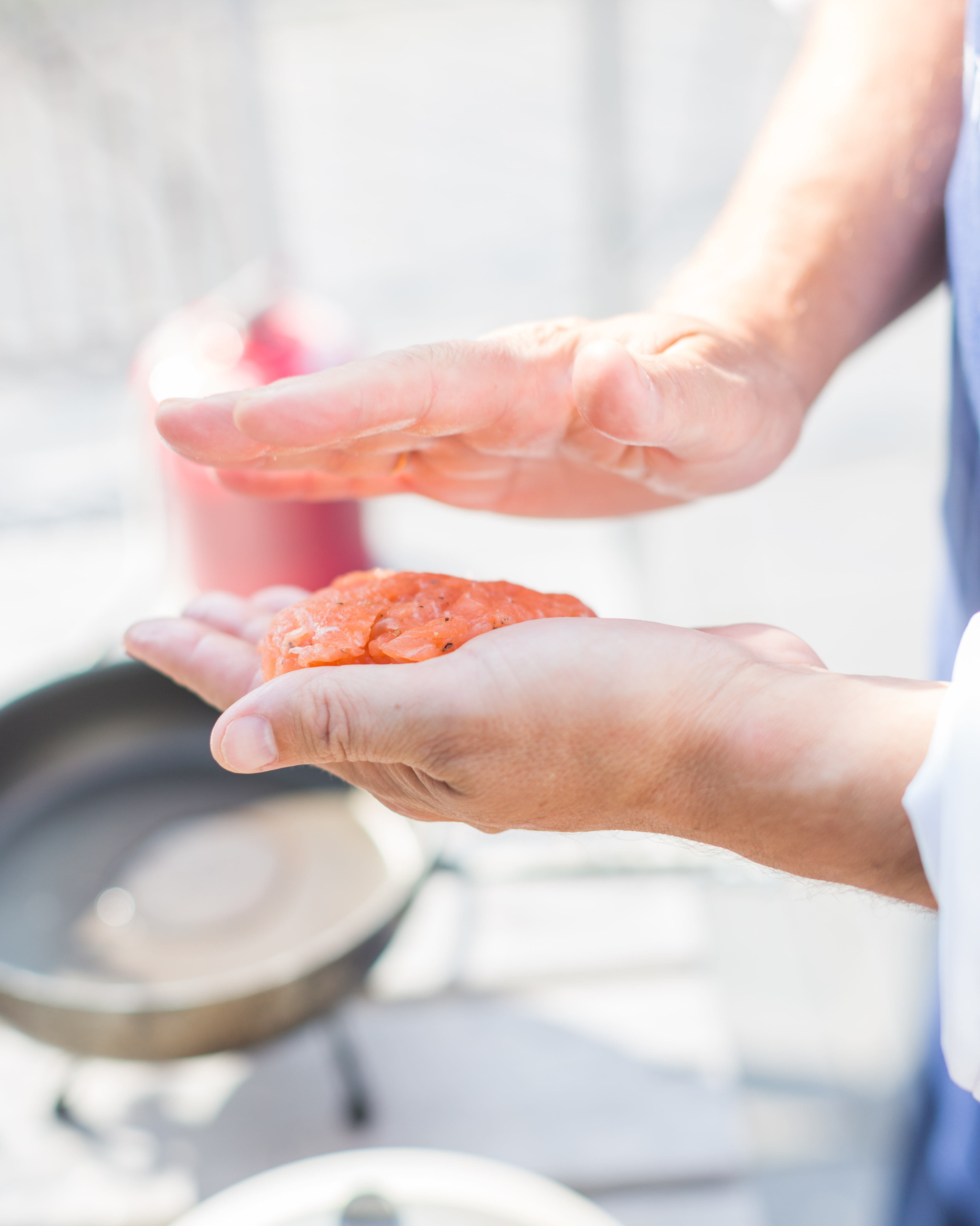 Chef with salmon burger